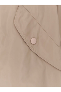 Beige aspesi women’s bombo nylon jacket pocket flap with matching button detail on fabric texture close-up