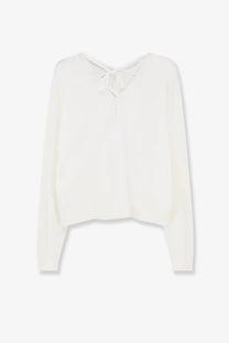 Aspesi women’s cotton sweater white shown from the back with a soft off-white silk blouse featuring a delicate back tie and long sleeves
