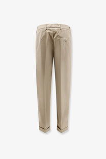 Beige aspesi women’s cotton chino trousers with subtle back pleat and rolled cuffs in coloniale style visible from back