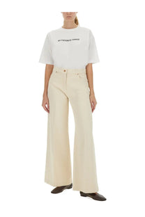 Cream-colored wide-leg trousers with a clean minimalist design featured with aspesi women’s shirt white