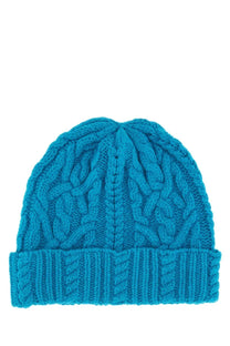 Vibrant turquoise aspesi women’s woolen hat with cable knit texture and ribbed cuff for cold weather use