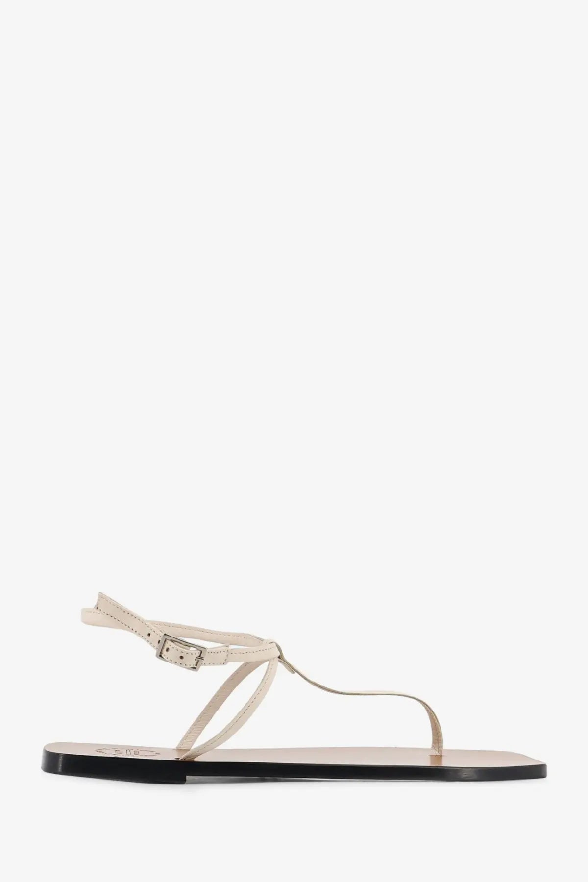 Cream-colored leather thong sandal with minimalist design and black rubber sole from ATP Atelier women’s Alassio Linen collection