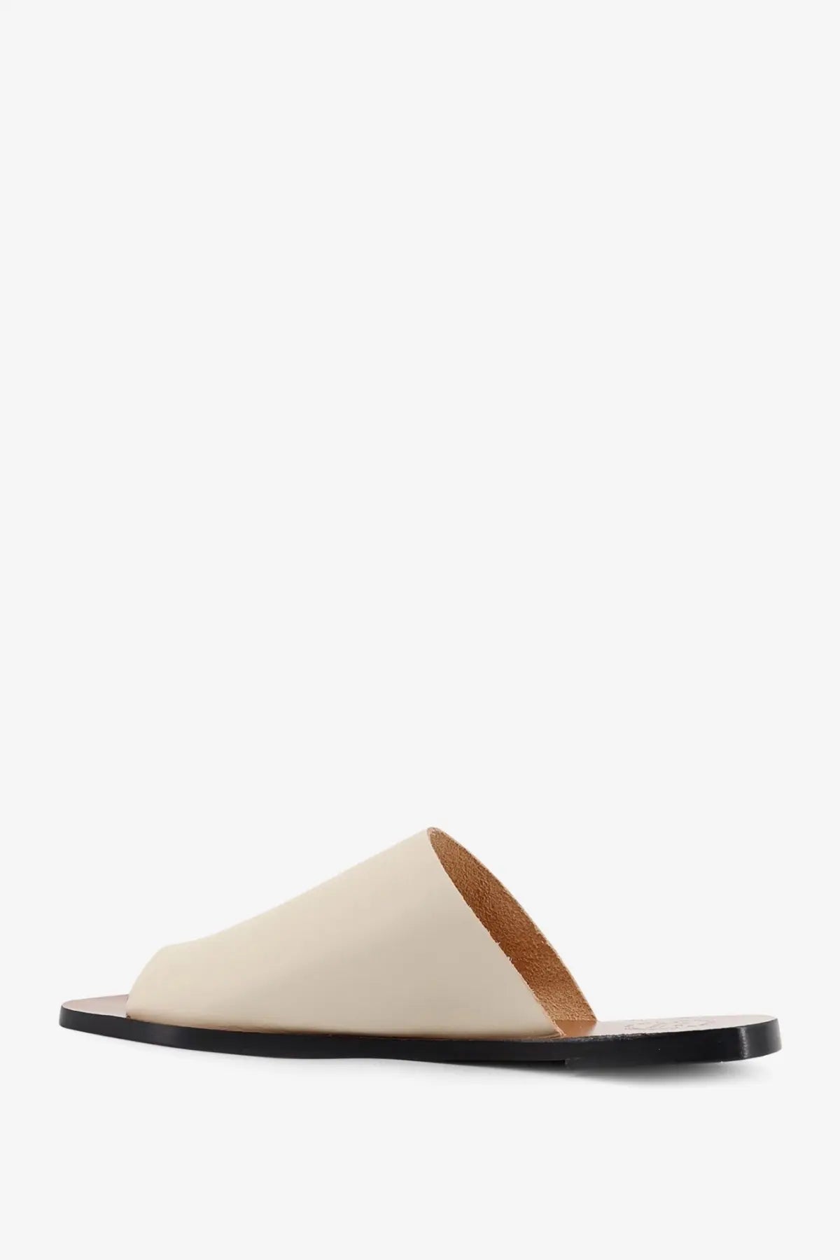 Cream-colored leather slide sandal with black sole and tan lining by ATP Atelier women’s rosa linen sandals