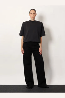 The attico oversized black short-sleeved top features a high neckline and relaxed fit for casual wear