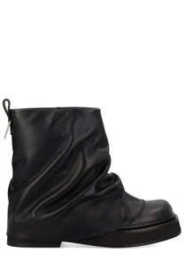 The attico women’s black leather ankle boot with a slouchy draped upper and thick platform sole