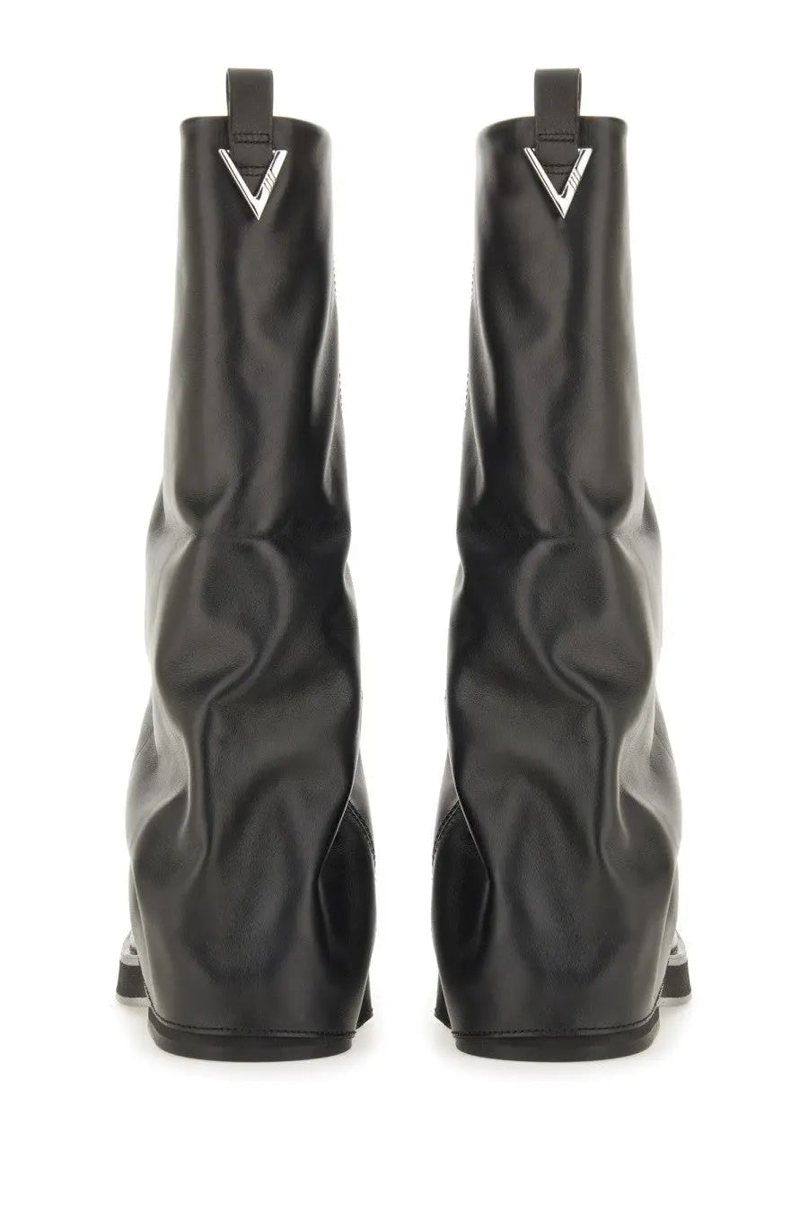 The attico women’s combat boot robin black made of glossy black leather with a silver triangular logo at the top