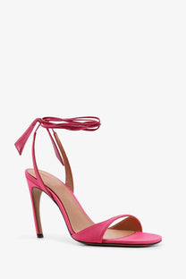 The Attico women’s ora satin sandals in vibrant pink feature a slender high heel and ankle tie strap design