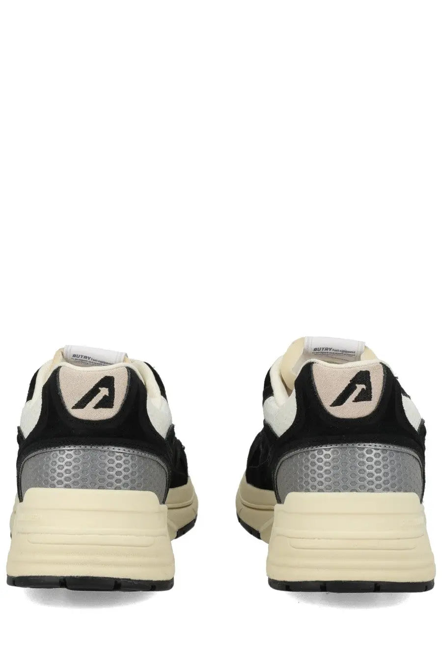 Back view of autry men’s hyperway sneaker black with cream and black leather and silver honeycomb heel panel
