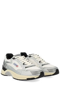Autry men’s hyperway sneaker white with white and gray mesh upper rubber sole and black accents athletic shoe