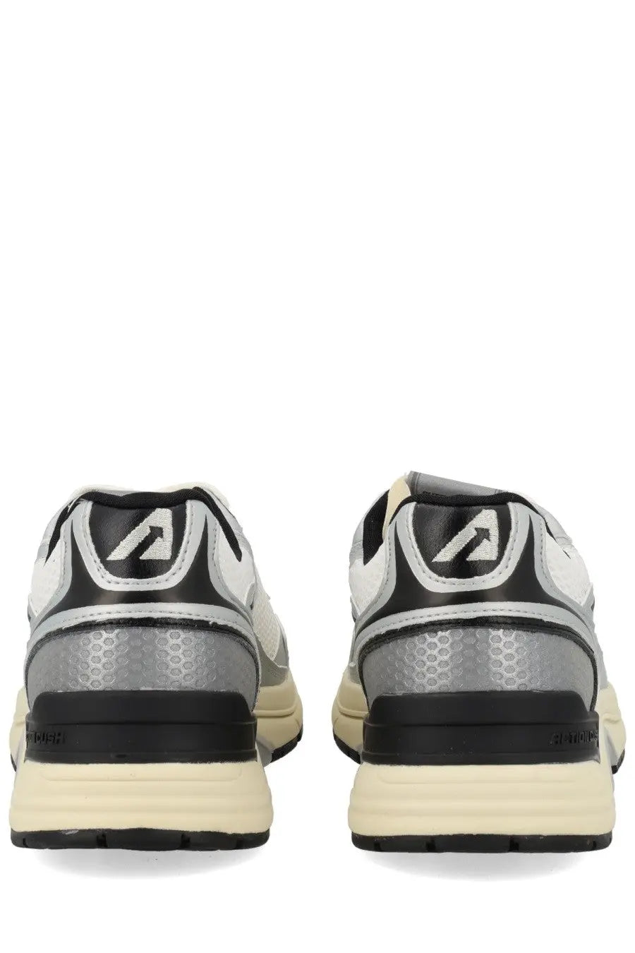 Back view of autry men’s hyperway sneaker white in silver and black with honeycomb heel pattern and cream rubber sole