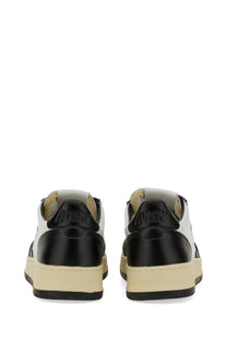 Black and white low-top autry men’s sneaker medalist low with glossy finish and embossed brand name on the heel back side