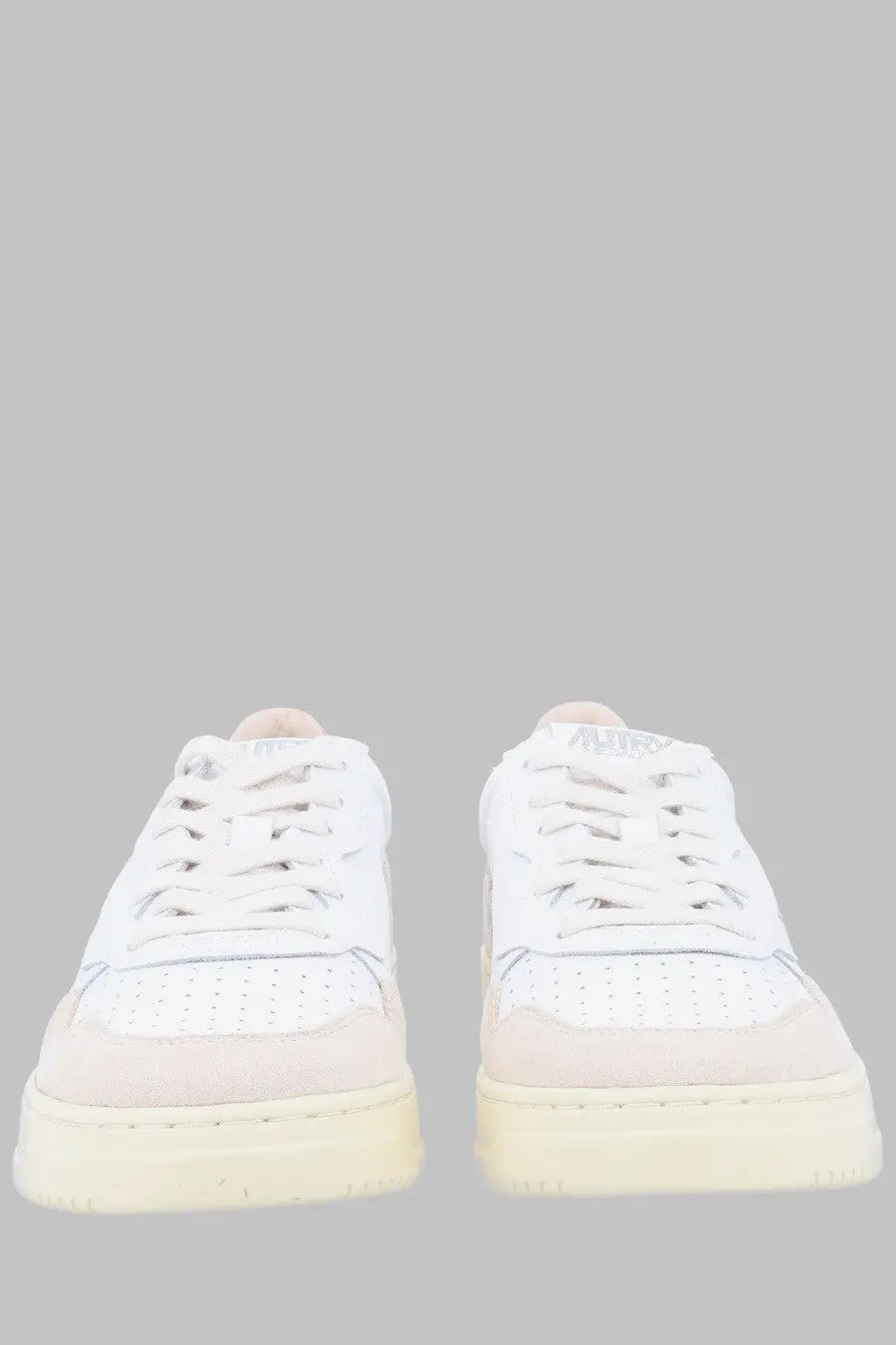 Autry men’s sneaker medalist low with white and pale pink perforated leather and suede accents on cream sole