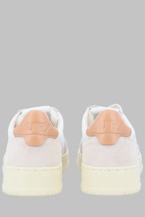 Back view of autry men’s sneaker medalist low multicolor in white suede with peach leather heel tabs and cream sole