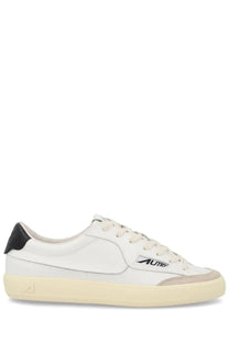 Autry men’s sneaker windscape low white leather low-top with black heel tab cream rubber sole and subtle logo on side