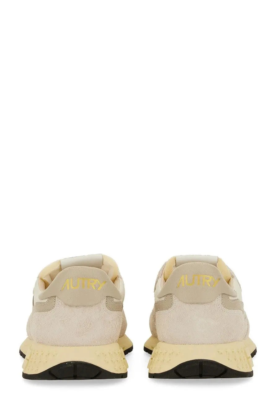 Beige suede autry men’s sneakers reelwind low with pale yellow rubber sole and gold branding on the back heel