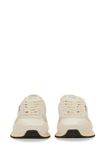 Back view of autry men’s sneakers reelwind low cream suede and canvas with black rubber sole and aury embossed heel