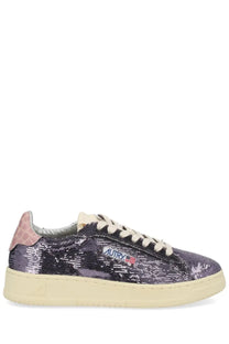 Autry women’s Dallas low sneaker in shimmering gray sequins with pink crocodile heel tab and cream laces