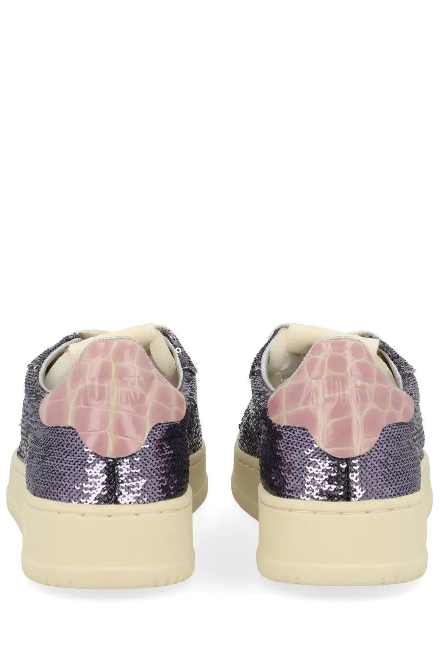 Autry women’s Dallas low sneaker in purple with sequins pink crocodile heel tabs and cream soles shown from the back
