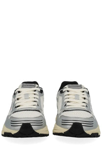 Autry women’s Hyperway sneaker in silver and black with white laces featuring mesh upper and rubber sole