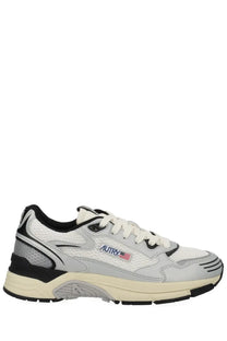 Autry women’s hyperway sneaker in white and gray with black accents mesh upper and chunky sole