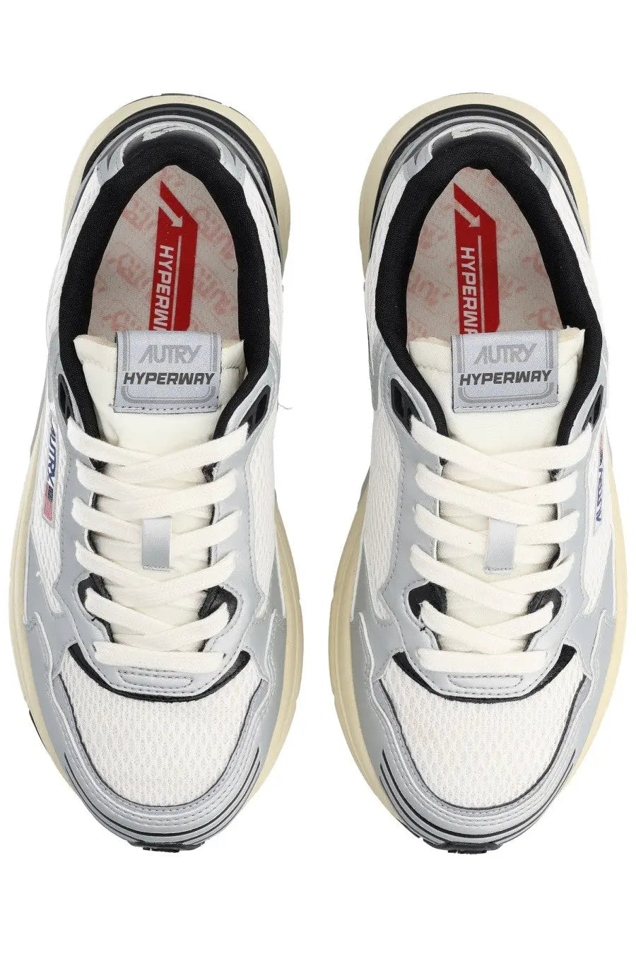Autry women’s hyperway sneaker in white and silver with black accents and chunky beige sole for casual wear