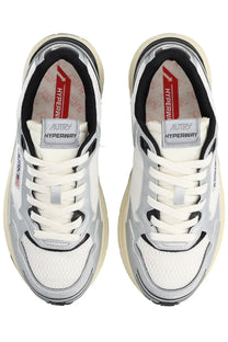 Autry women’s hyperway sneaker in white and silver with black accents and chunky beige sole for casual wear