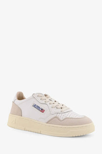 Autry women’s medalist low leather sneakers in white with beige suede perforated detailing and american flag logo