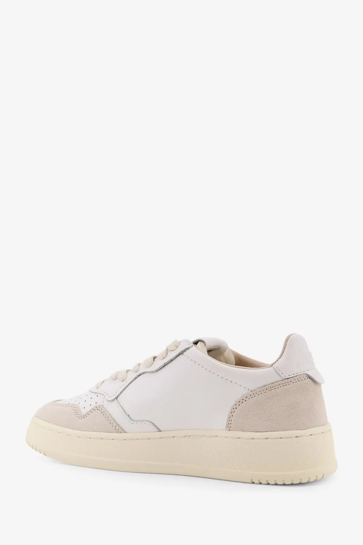 Autry women’s Medalist low leather sneakers in white with beige suede toe cap and chunky rubber sole