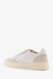 Autry women’s Medalist low leather sneakers in white with beige suede toe cap and chunky rubber sole