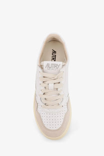 Autry women’s medalist low leather sneaker in white with perforated toe box and beige rubber sole