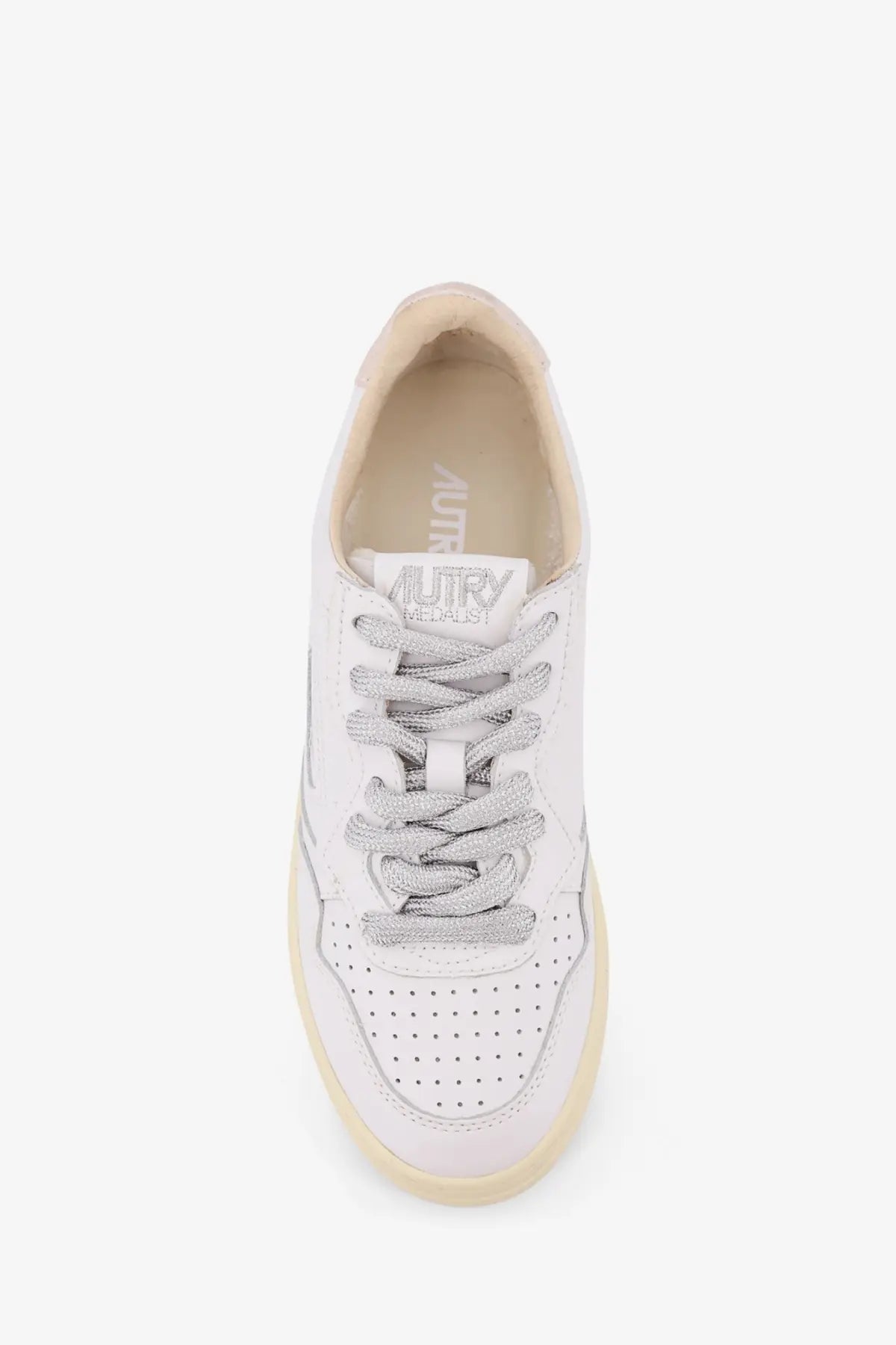 Autry women’s Medalist low leather sneaker in white with silver glitter laces and cream rubber sole