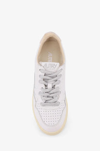 Autry women’s Medalist low leather sneaker in white with silver glitter laces and cream rubber sole