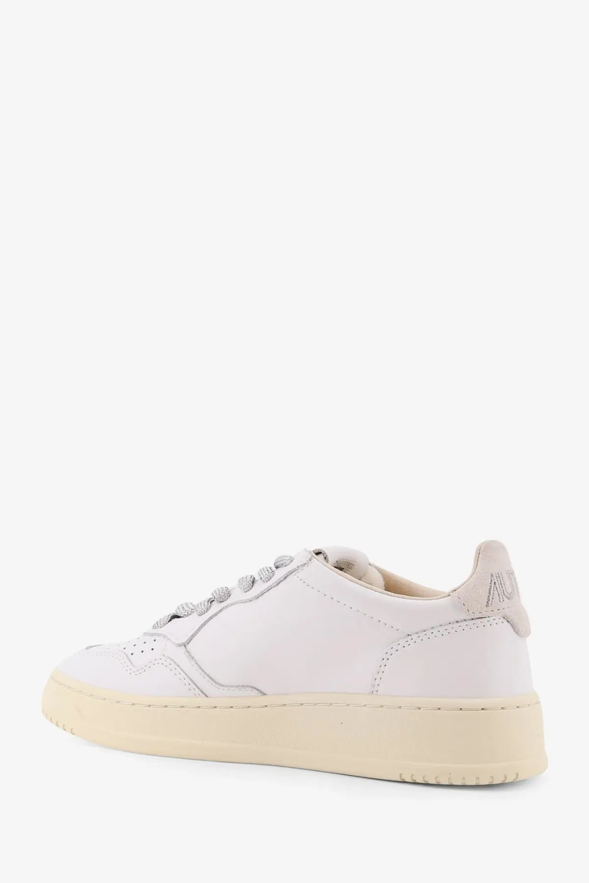 Autry women’s medalist low leather sneaker in white with cream rubber sole and silver-toned laces