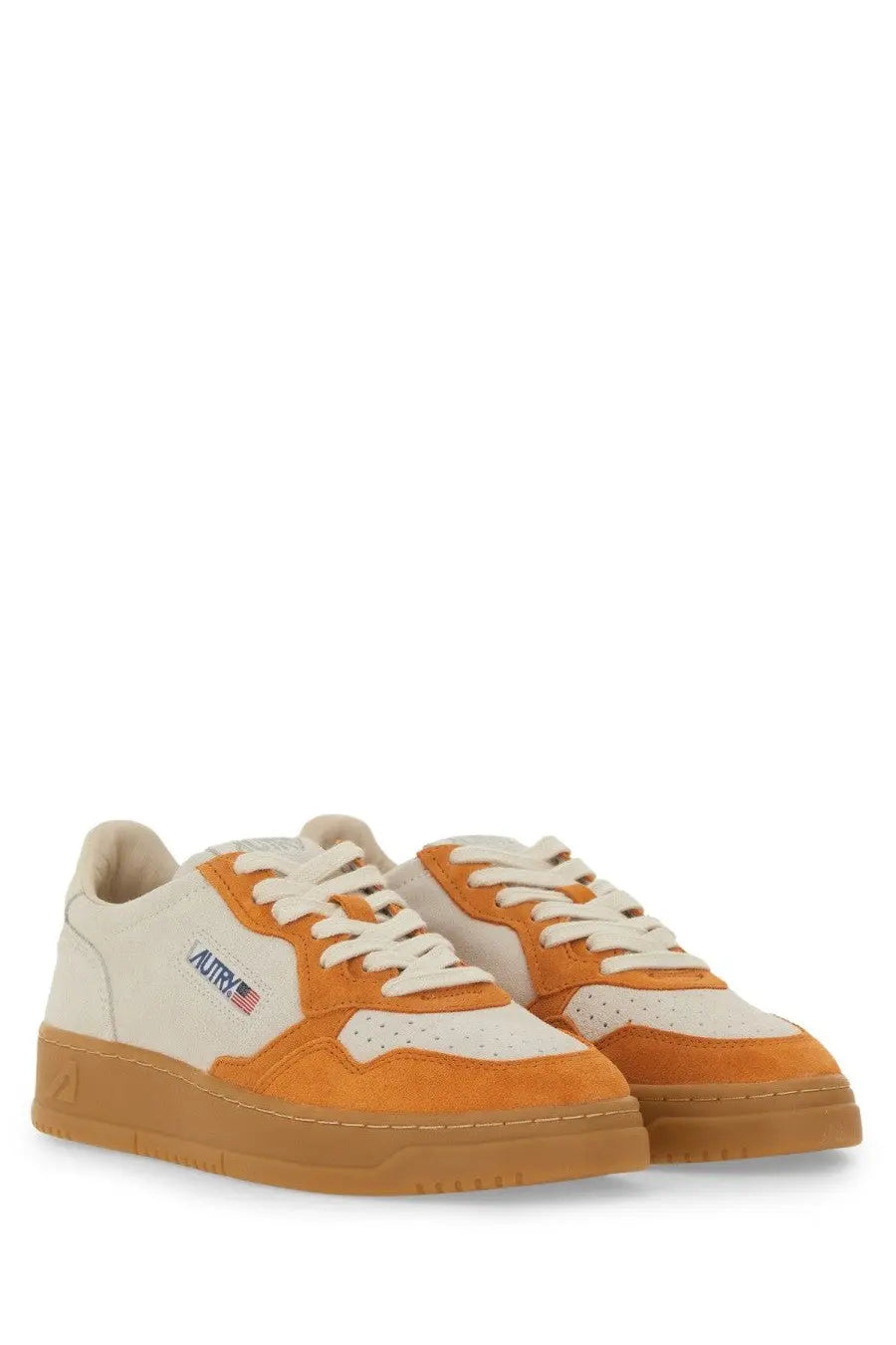 Autry women’s medalist low sneaker in cream and orange suede with gum rubber sole for casual wear