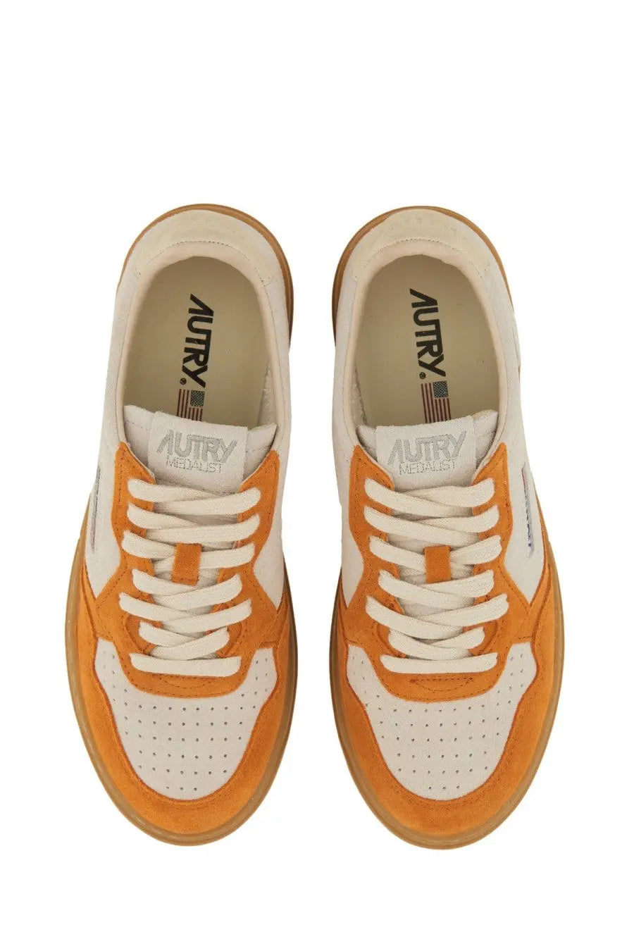 Autry women’s medalist low sneaker in orange and white suede and leather with a gum rubber sole
