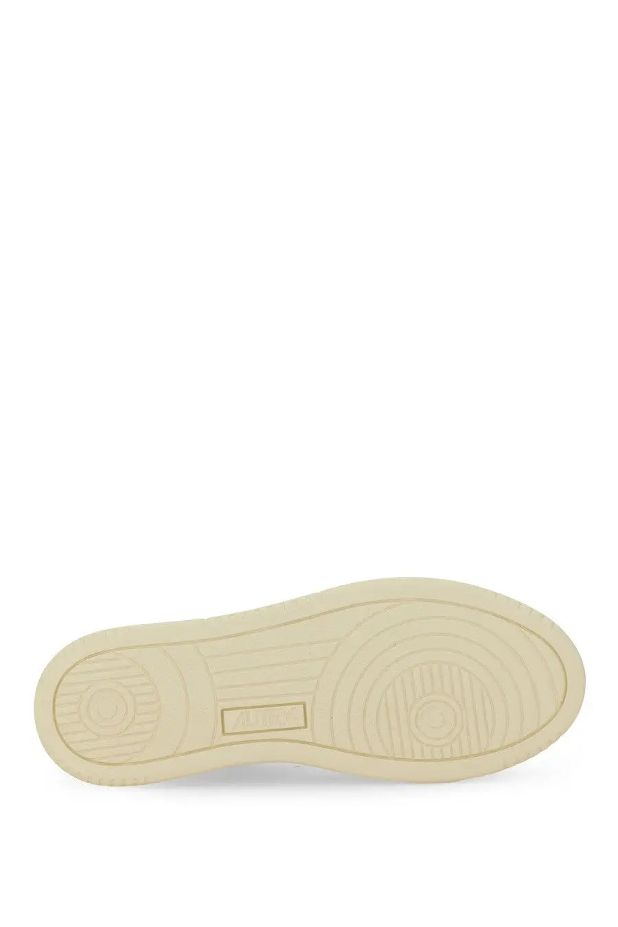Cream-colored rubber sole with circular tread patterns and rectangular brand logo on autry women’s medalist low sneaker silver