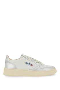 Autry women’s Medalist low sneaker in silver metallic leather with cream rubber sole and logo patch