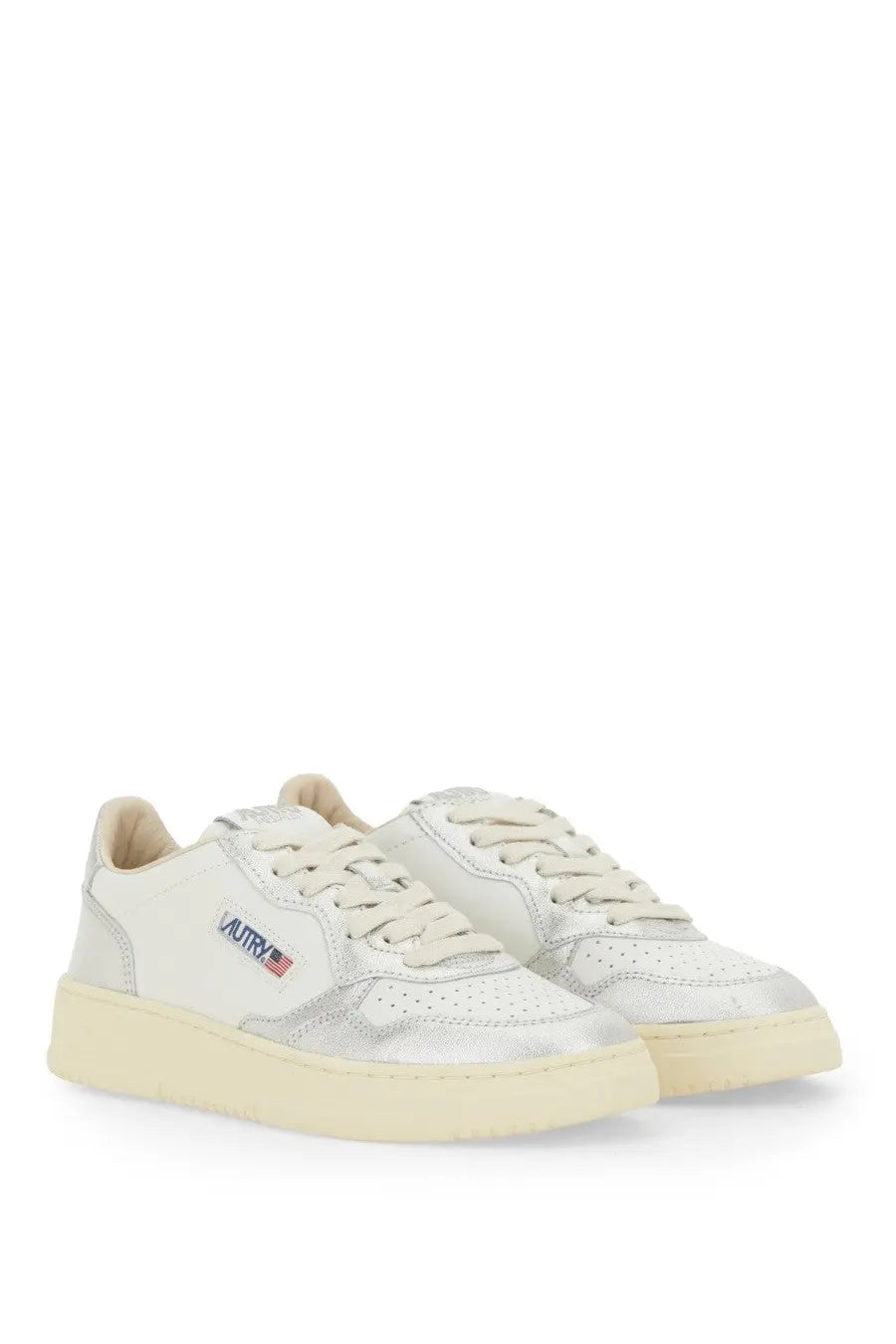 Autry women’s medalist low sneaker in white and silver metallic leather with cream laces and subtle autry logo