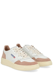 Autry women’s medalist low sneaker in white featuring beige suede and leather with perforated toe box and cream rubber sole