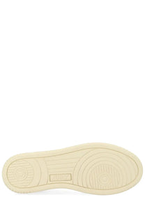Cream-colored rubber sole with circular tread patterns and embossed logo on the back of autry women’s medalist low sneaker white