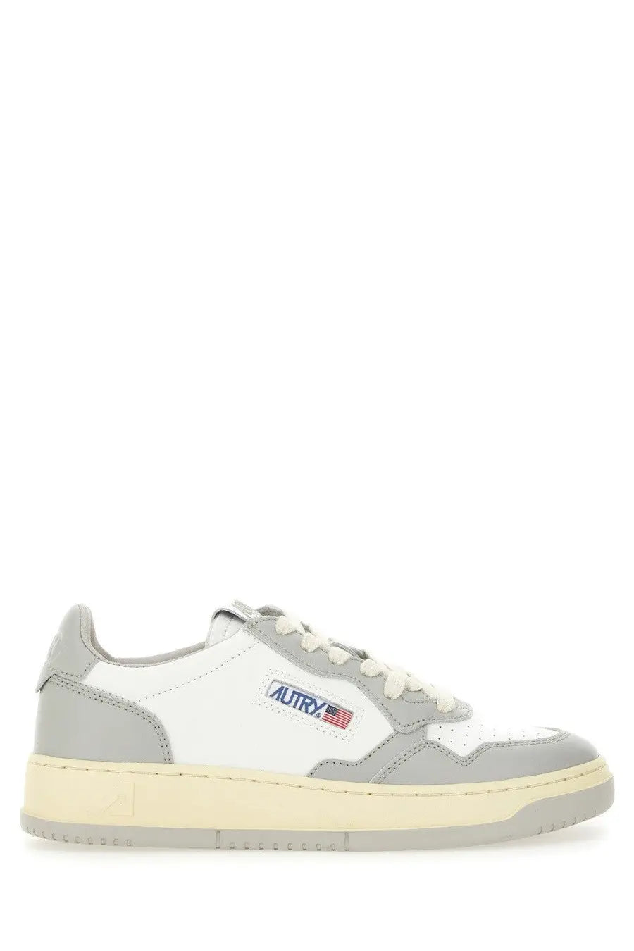 Autry women’s medalist low sneaker in white and gray with beige rubber sole and autry logo patch on the side