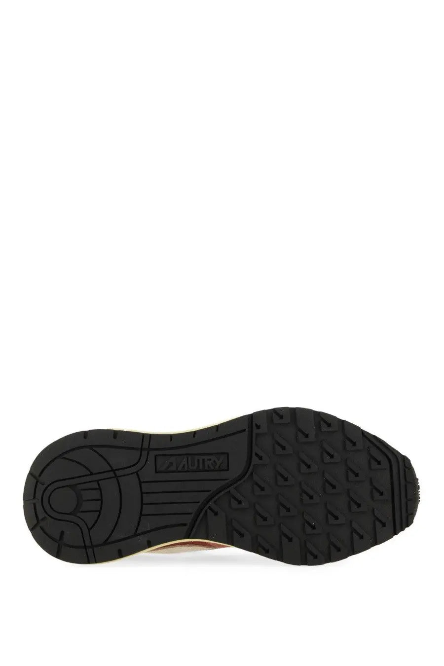 Back view of autry women’s reelwind low sneaker red showing black rubber sole with textured tread and aurum brand name embossed