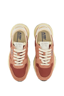 Autry women’s reelwind low sneaker in muted terracotta and cream suede with white laces and chunky sole