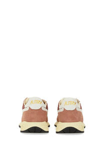 Autry women’s reelwind low sneaker red with dusty rose and white suede upper and gold lettering on heel tab back view