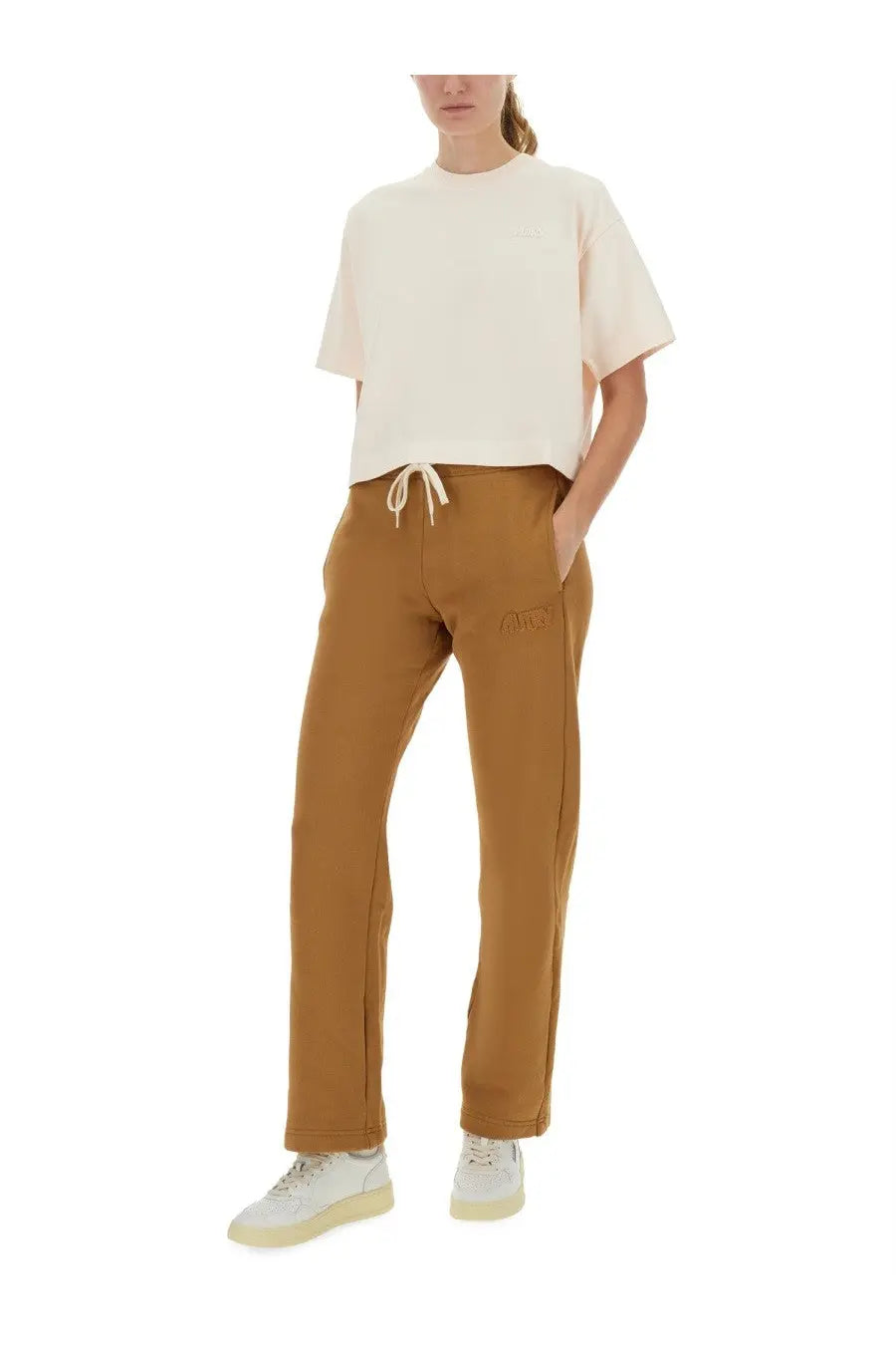 Tan cotton joggers with subtle embroidered logo on thigh and matching drawstring waistband for autry women’s shirt white