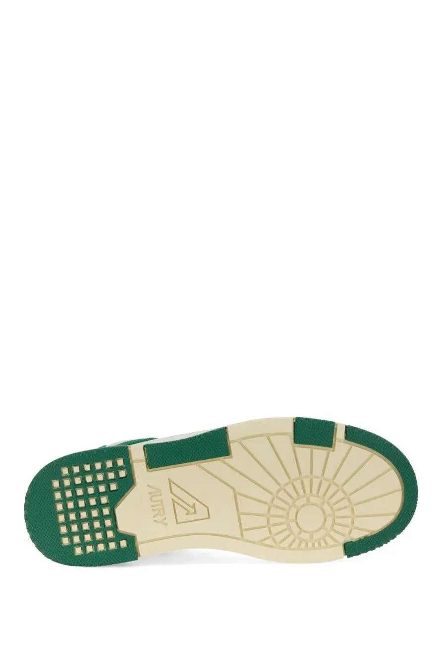 Close-up of autry women’s sneaker clc multicolor green and beige rubber sole with textured pattern and audi logo near heel
