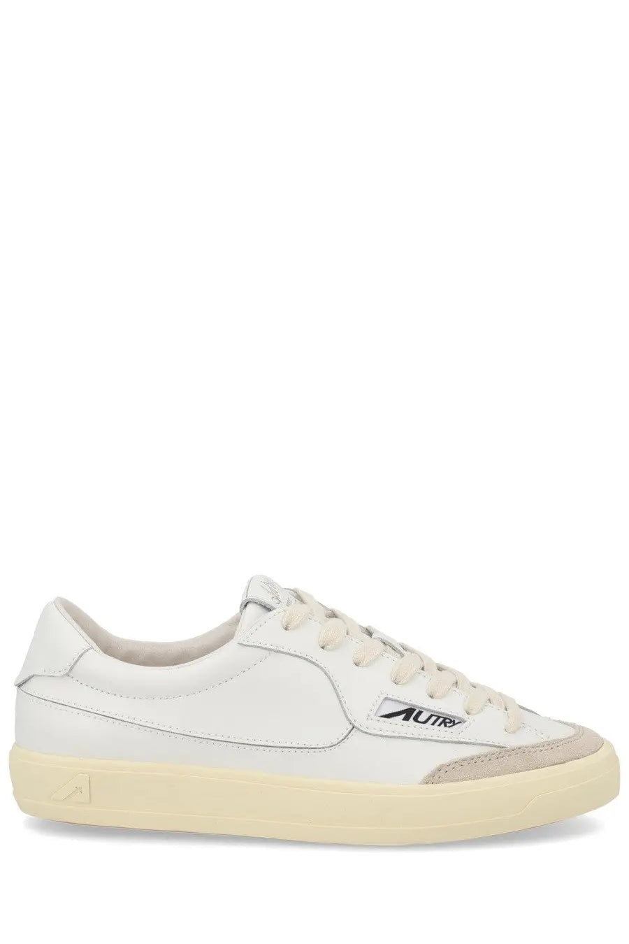 Autry women’s sneaker windscape low white leather sneaker with beige rubber sole and subtle gray accents