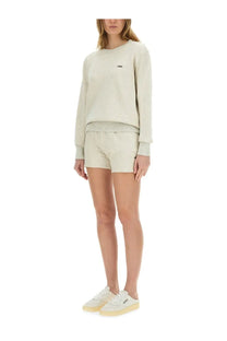 Autry women’s beige sweatshirt shorts made of soft cream-colored cotton with a subtle embroidered chest logo