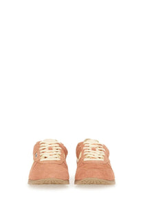 Autry women’s windspin low sneaker in peach suede with cream laces and tan rubber sole