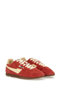 Autry women’s windspin low sneaker red featuring red suede with cream accents and laces in a retro design